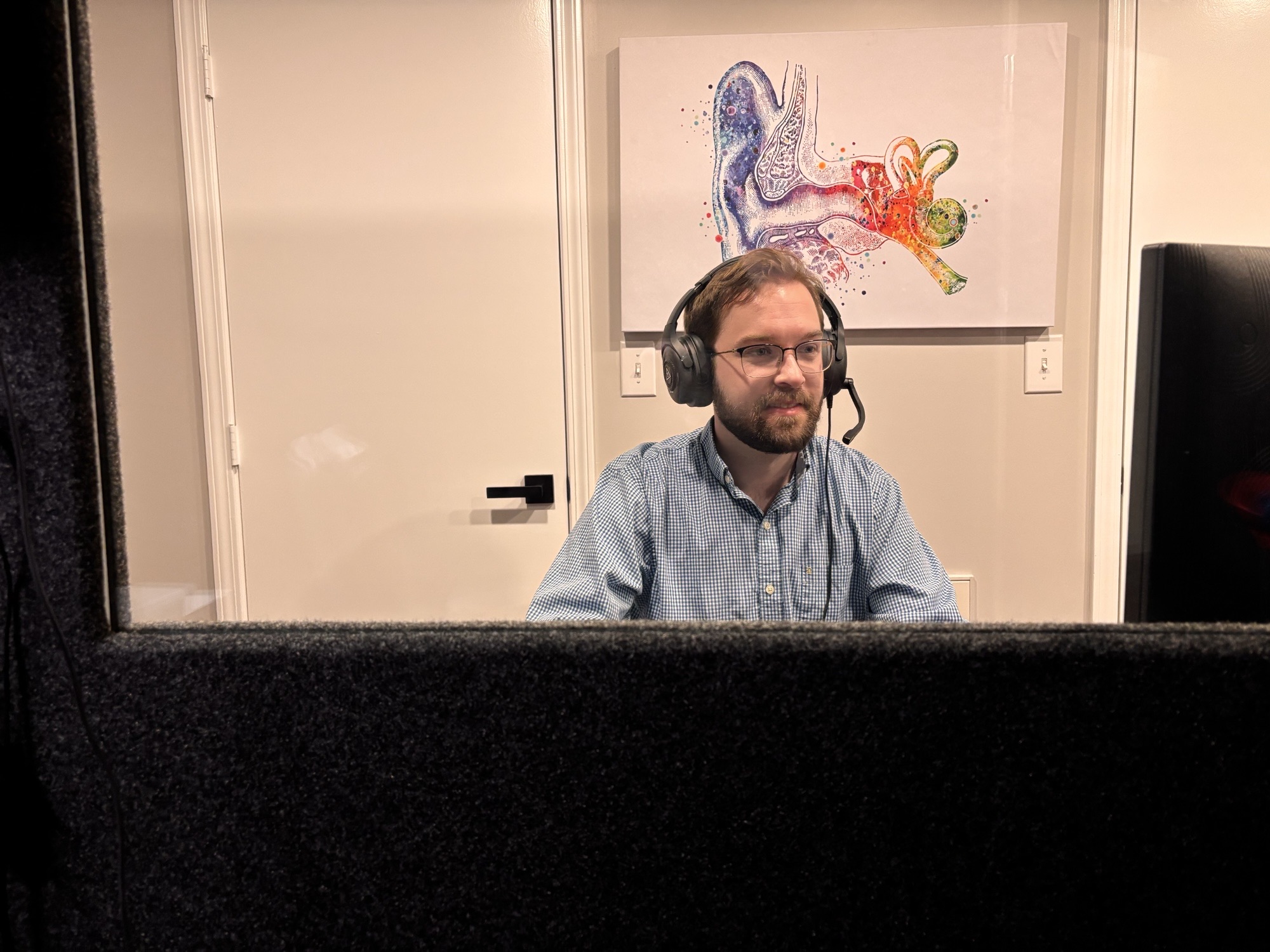 Dr. Scott Capece performing a hearing test at Elevate Audiology in Greenville